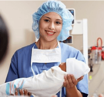Nurse in scrubs holding baby